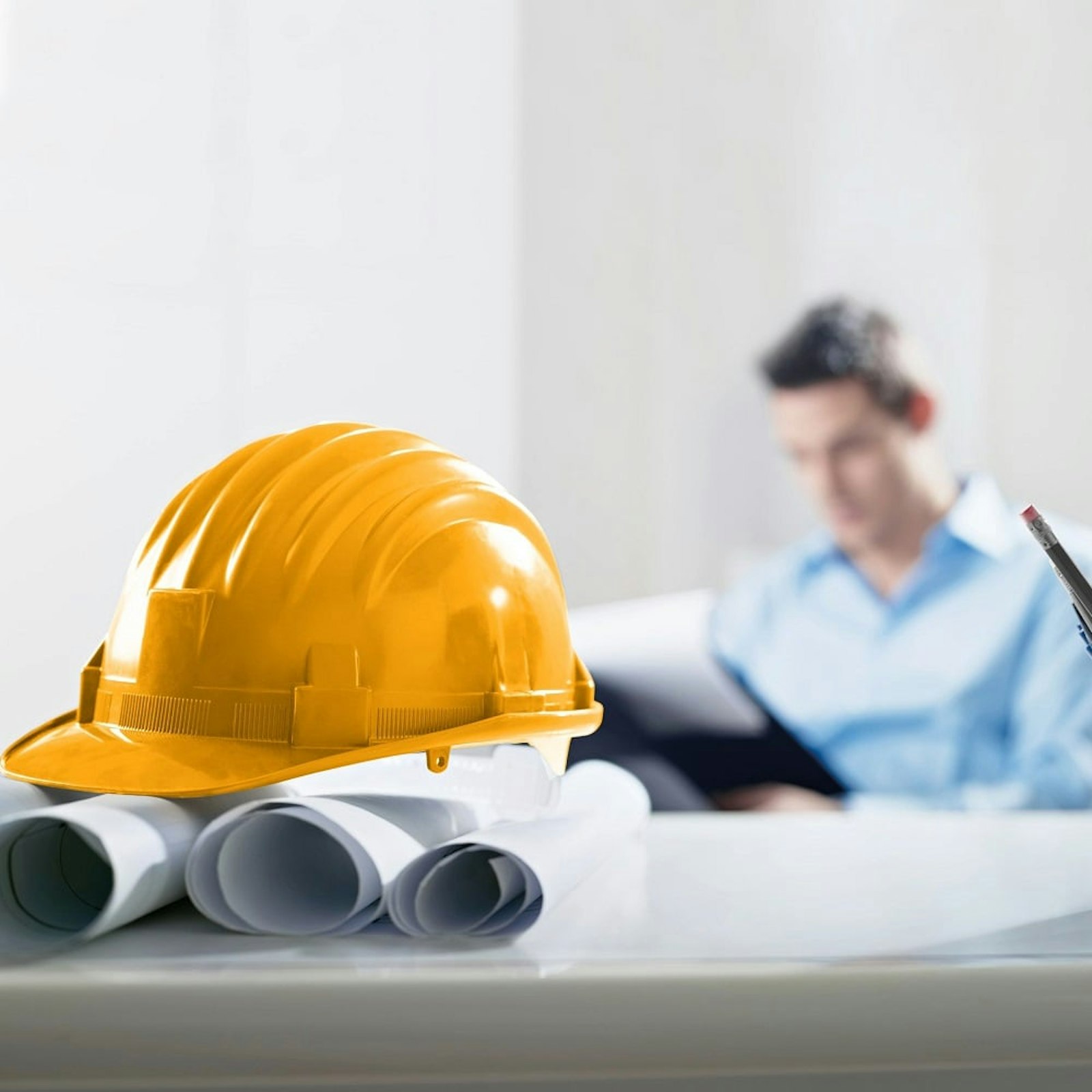 construction plans and hardhat